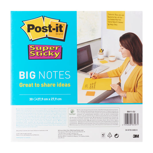 Eine Frau schreibt auf einem großen gelben Post-it® Super Sticky Big Note (BN11-EU, 279 mm x 279 mm, 30 Blatt, 100% PEFC) von 3M Deutschland GmbH an ihrem Schreibtisch mit Laptop und Notizbüchern; die Verpackung zeigt Produktdetails.