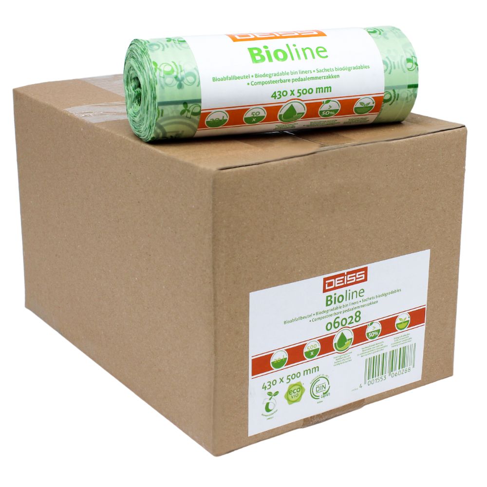 Un carton portant l'inscription « EMIL DEISS KG (GmbH + Co.) » sur lequel est posé un rouleau de sacs poubelles verts 100 % compostables. Les sacs sont étiquetés « 430 x 500 mm », ce qui correspond à leurs dimensions. Les deux articles sont présentés sur un fond blanc uni.