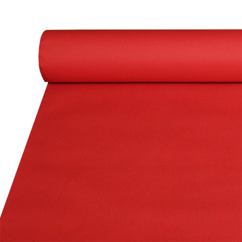 Eine große Rolle Starpak-Tischdecke, stoffähnlich Airlaid (20 m x 1,2 m), teilweise auf einer flachen Oberfläche ausgerollt, zeigt ihr glattes, stoffähnliches Aussehen, das langlebig und leicht zu reinigen ist.