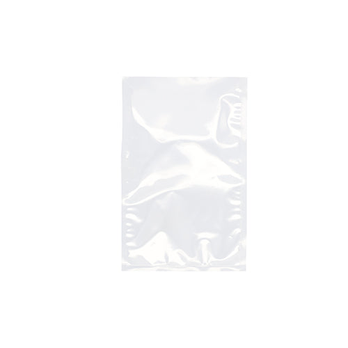 Un sachet à souder Starpak 100 clair, PA/PE transparent, est posé à plat sur un fond blanc. Avec ses bords scellés, ce sac Starpak est idéal pour la mise sous vide des aliments avec une machine à vide à cloche.