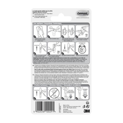 Au dos de l'emballage des crochets en métal Command™ "classique" de 3M Deutschland GmbH se trouvent un guide illustré étape par étape pour l'application et le retrait, des conseils multilingues et des avertissements de sécurité ainsi qu'un code-barres et des logos en bas.