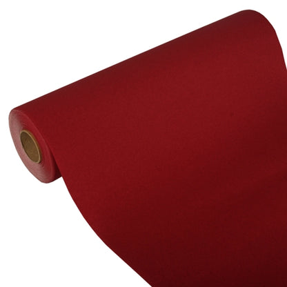 Un chemin de table partiellement déroulé de la société PAPSTAR, Tissue « ROYAL Collection » (24 m x 40 cm), montre son noyau en carton sur un fond blanc, démontrant ainsi son matériau en tissu de haute qualité et son design élégant.