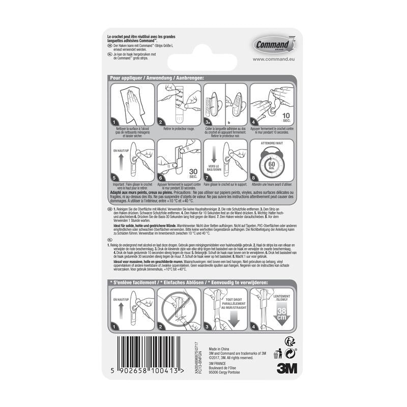 Arrière de l'emballage des crochets en métal Command™ "classique" (3M Deutschland GmbH) avec un guide illustré étape par étape en plusieurs langues pour une utilisation et un retrait corrects, ainsi que des avertissements et des informations sur le produit en bas.
