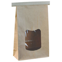 Le sachet à fermeture avec fenêtre transparente d'Abena Re-Seller GmbH, en papier brun, est présenté debout sur un fond blanc ; grâce à sa fenêtre rectangulaire et à sa fermeture à rabat, il est idéal pour une présentation attrayante du produit.