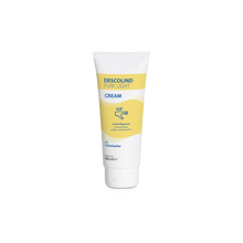 Eine weiße 100-ml-Tube der Dr. Schumacher Descolind Pure Light Cream Pflegecreme für empfindliche Haut mit gelben und blauen Akzenten und dem Schriftzug der Dr. Schumacher GmbH steht aufrecht auf einem schlichten weißen Hintergrund. Ideal für medizinisches Fachpersonal.