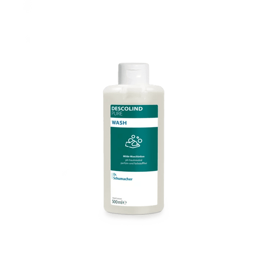 Un flacon en plastique blanc contenant la lotion lavante Dr. Schumacher Descolind Pure Wash (500 ml) de la société Dr. Schumacher GmbH, orné d'une étiquette verte et blanche, est présenté sur un fond gris clair sobre. Cette lotion lavante sans parfum, au pH neutre pour la peau, est idéale pour les peaux sensibles.