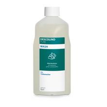 Dr. Schumacher Descolind Pure Wash Waschlotion der Dr. Schumacher GmbH in einer 1-Liter-Kunststoffflasche, pH-neutral und parfümfrei für empfindliche Haut, mit weißer Kappe und grün-weißem Etikett mit Produktinformation und Handwaschsymbol.