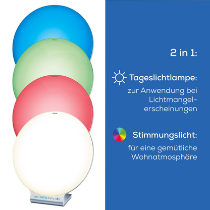 Une image avec quatre lumières circulaires en bleu, vert, rouge et blanc devant un fond dégradé. Le texte à droite dit : « 2 en 1 : lampe de jour pour les symptômes de manque de lumière. Lumière d'ambiance pour une atmosphère de vie confortable. » Contrôlez la lampe de jour Beurer TL 100 | facilement via l'application Beurer LightUp Pack (1 pièce) de Beurer GmbH pour un confort supplémentaire.