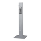 Der Dr. Schumacher Desipoint | Stück (1 Stück) der Dr. Schumacher GmbH ist ein hoher, rechteckiger Handdesinfektionsmittelspender mit Metallic-Finish auf einem flachen, quadratischen Sockel, ideal für hygienische Desinfektionsmittel und Oberflächenreinigung auf einem schlichten weißen Untergrund.