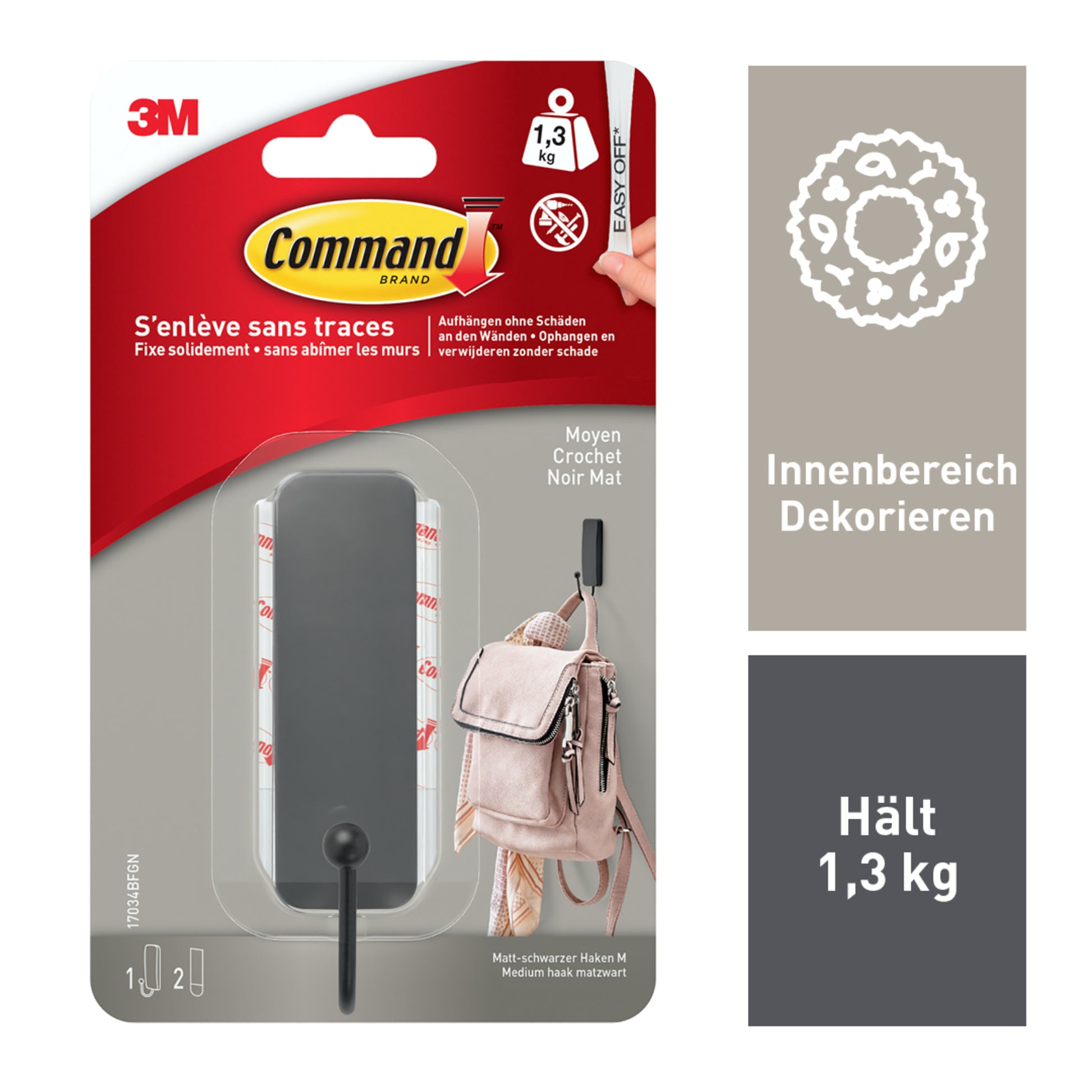 Der 3M Command™ Mattschwarzer Haken, 17034B, mittelgroß, wird in der Verpackung mit 1 Haken und 2 Strips gezeigt. Geeignet für die Dekoration drinnen, hält bis zu 1,3 kg und lässt sich rückstandsfrei entfernen.