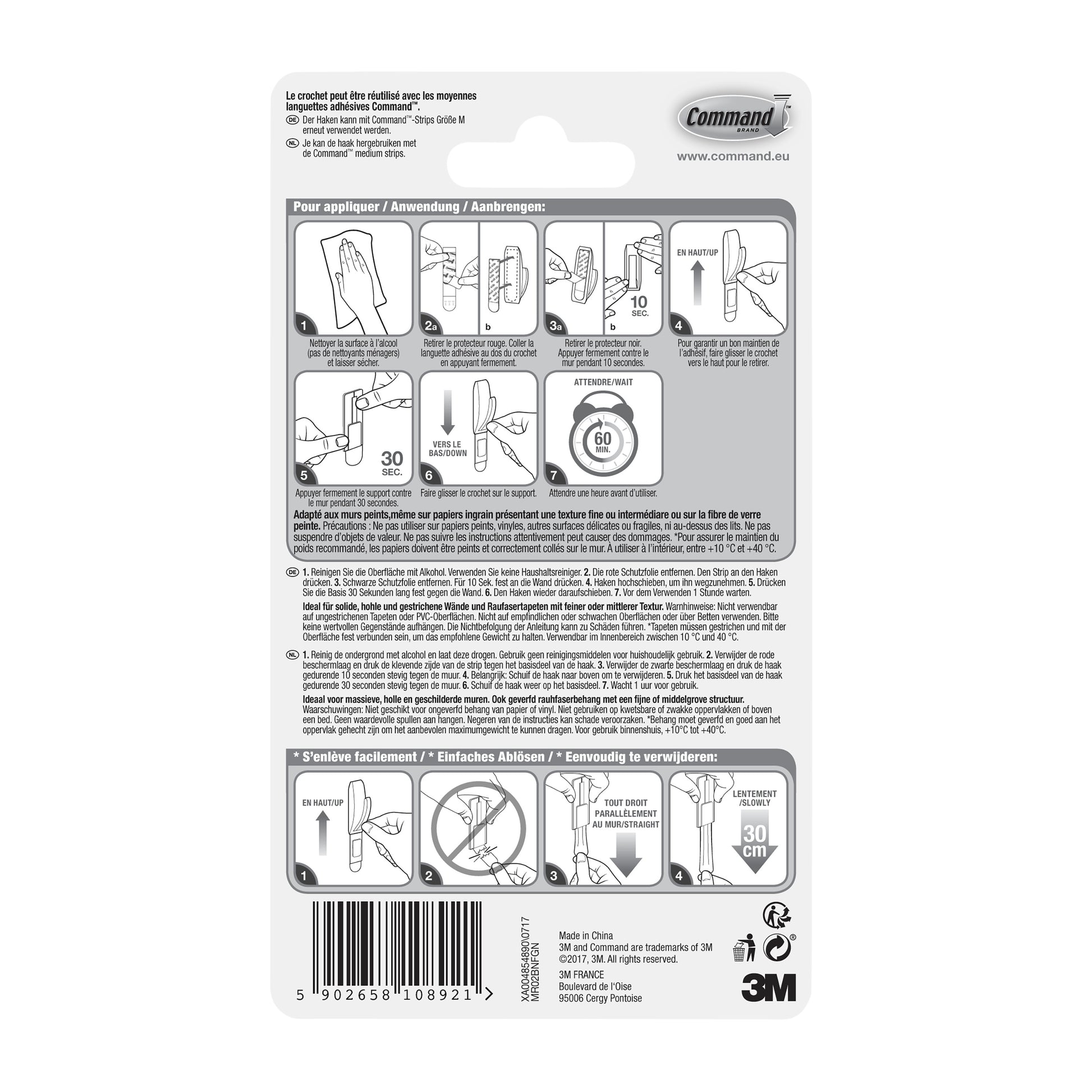 Rückseite einer Command™ Metallhaken "Modern Reflection"-Verpackung der 3M Deutschland GmbH, mit bebilderter Schritt-für-Schritt-Anleitung zum Anbringen und Entfernen des Hakens, mit mehrsprachigem Text und einem Barcode am unteren Rand.