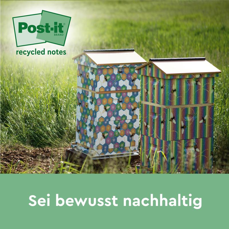 Deux ruches vives se tiennent sur une prairie, à côté des notes de recyclage Post-it®, 76 mm x 127 mm, 100 feuilles/bloc, 100% PEFC de 3M Deutschland GmbH. Une légende indique : "Soyez consciemment durable".