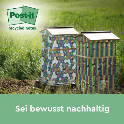 Deux ruches vives se tiennent sur une prairie, à côté des notes de recyclage Post-it®, 76 mm x 127 mm, 100 feuilles/bloc, 100% PEFC de 3M Deutschland GmbH. Une légende indique : "Soyez consciemment durable".